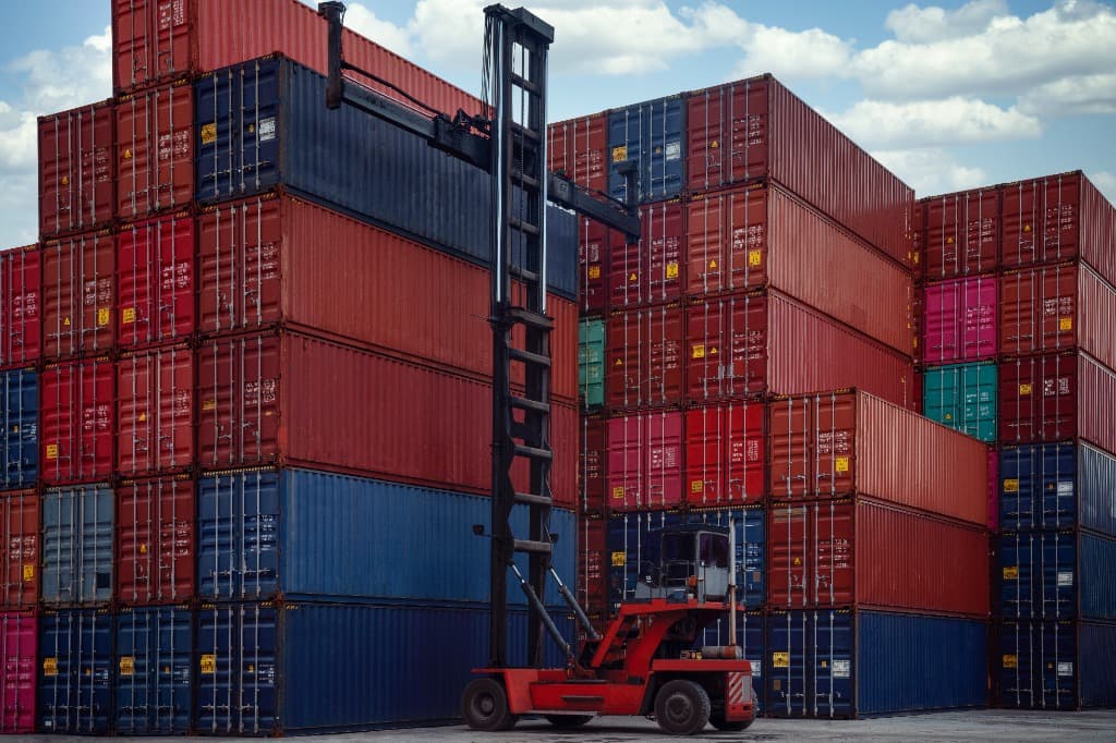 Container stacks and handling equipment in cargo yard